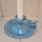 Vintage blue enamel French chamber candlestick on white table