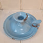 Vintage blue enamel French chamber candlestick on white table