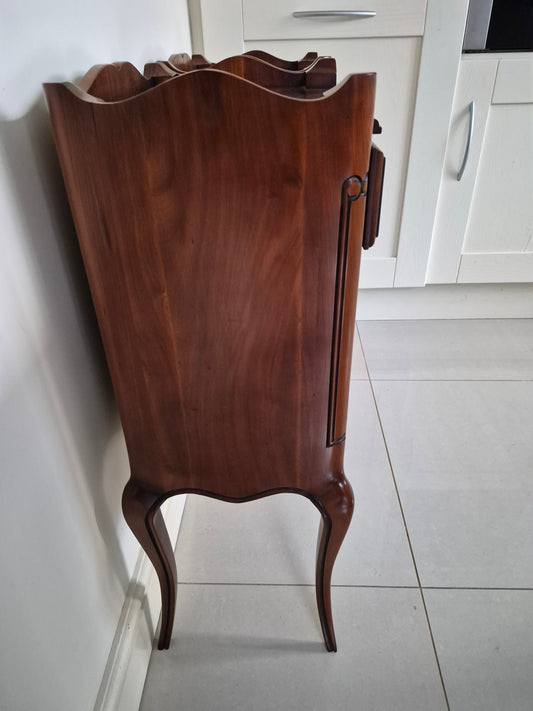 Side view of dark wood bedsisde table 