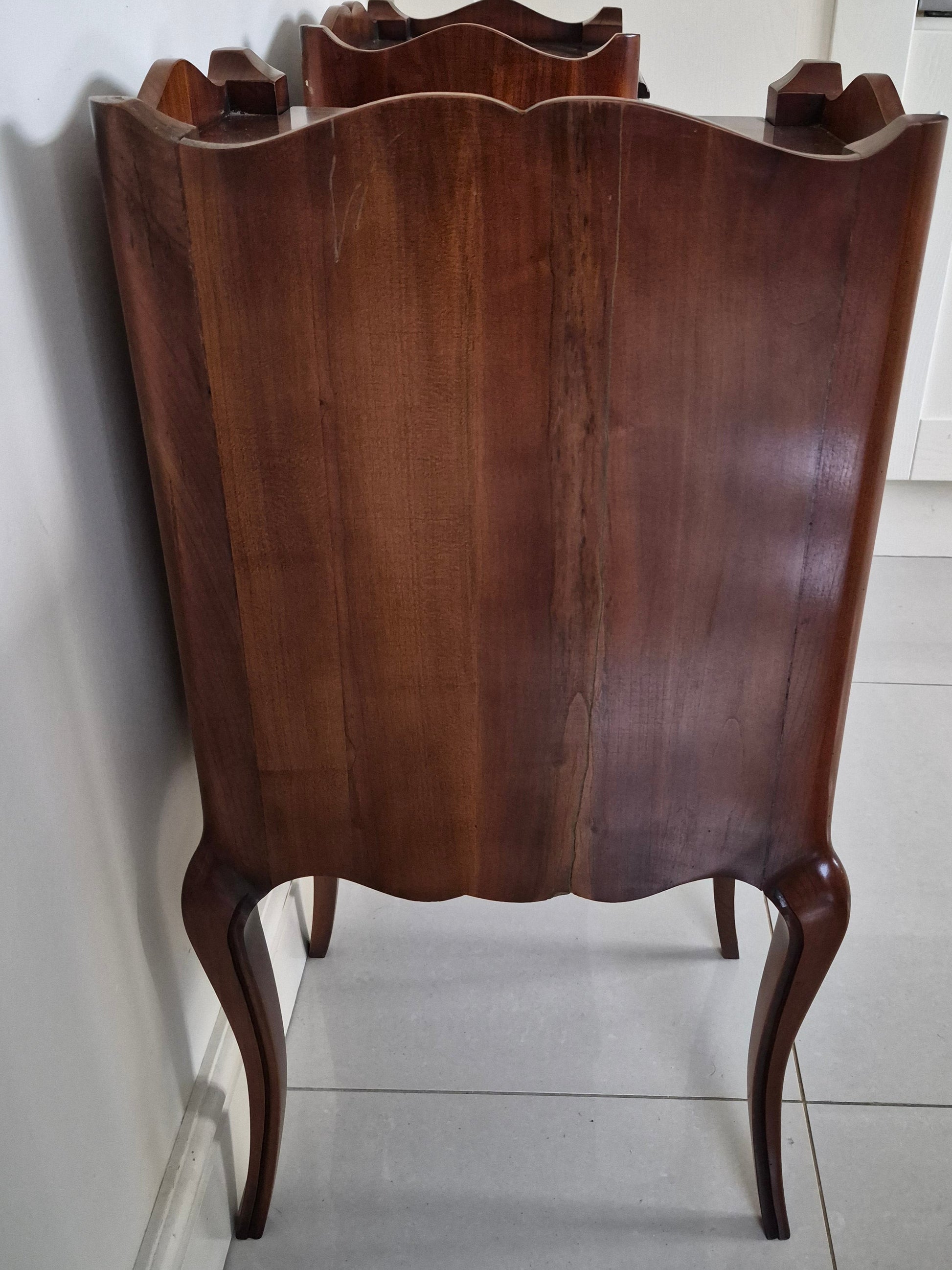 Back view of dark wood bedside tables 