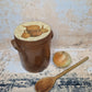 Vintage French tall lidded confit jar with onion design decorated lid